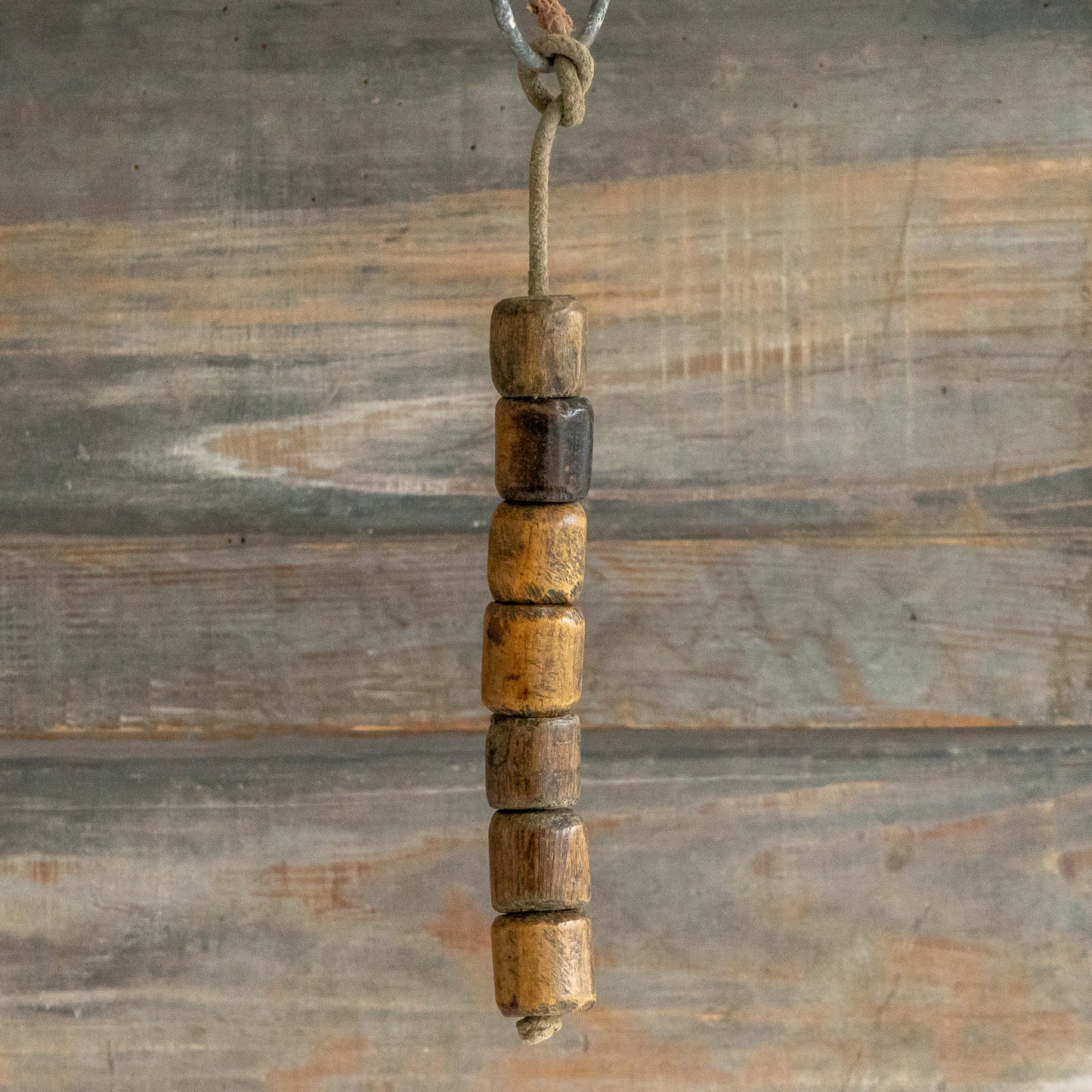 String of 7 Wooden Plumbers Bobbins