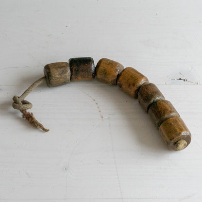 String of 7 Wooden Plumbers Bobbins