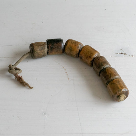 String of 7 Wooden Plumbers Bobbins