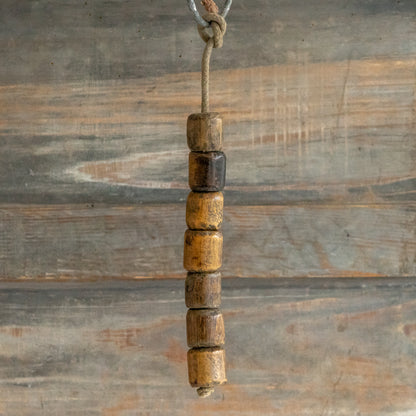 String of 7 Wooden Plumbers Bobbins