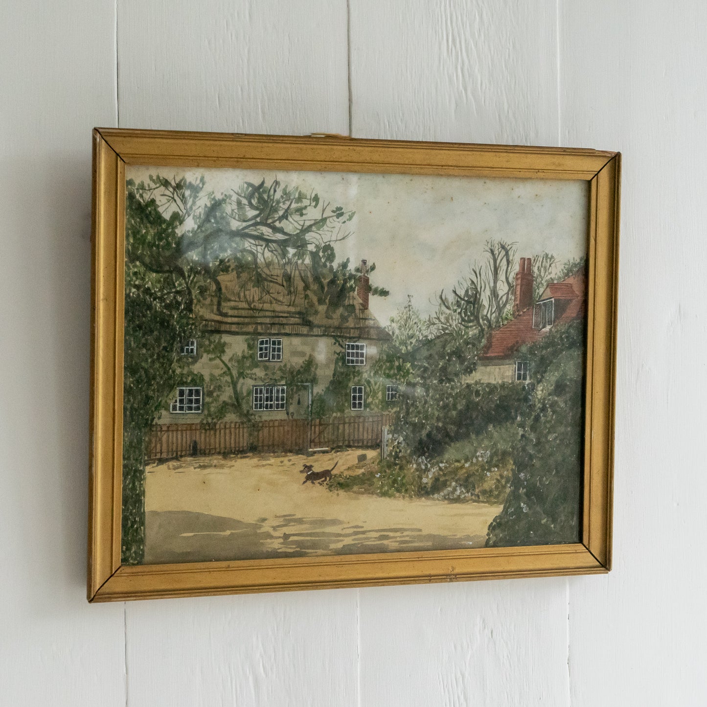 Framed Watercolour Painting of a Dog outside a Cottage