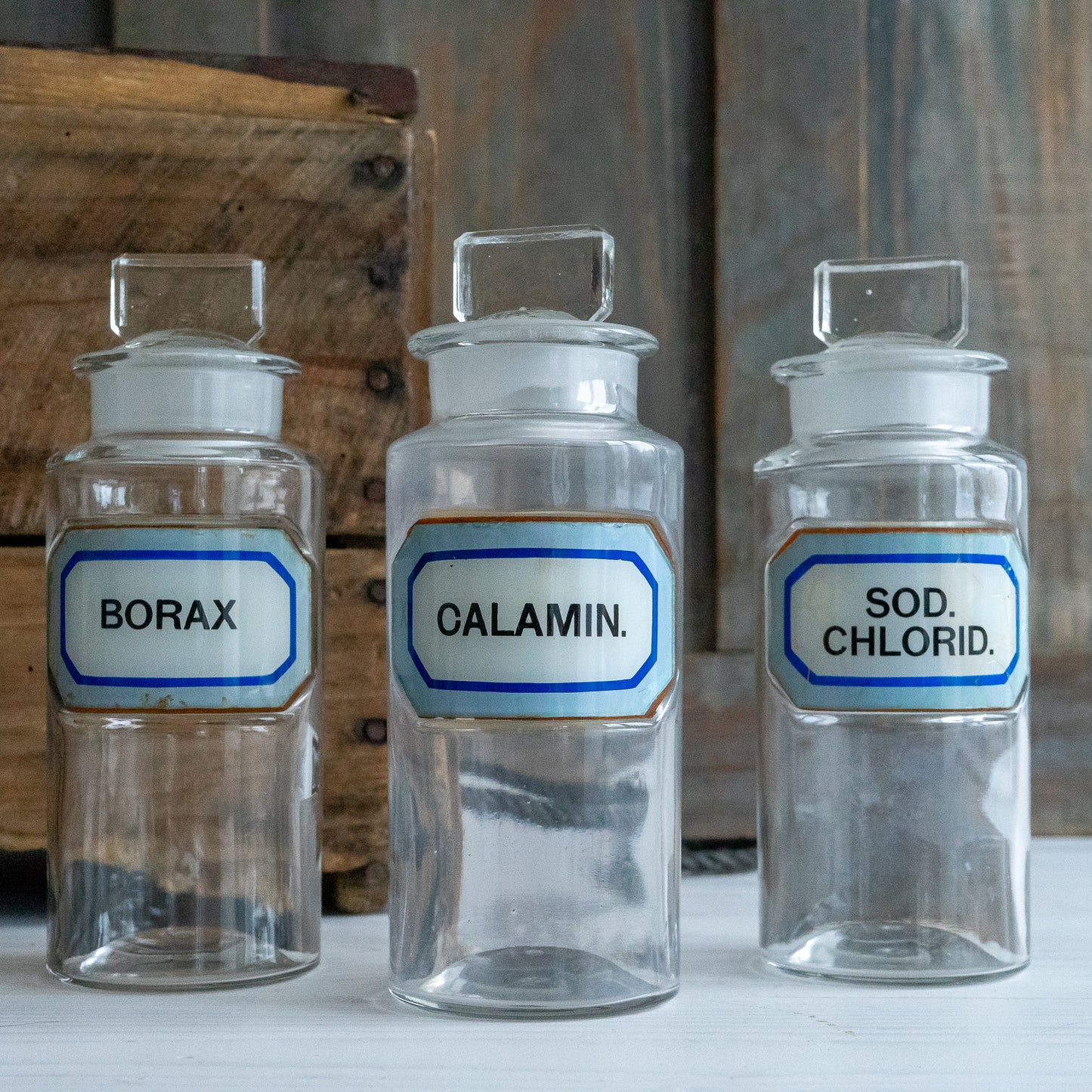 Vintage Glass Chemistry Bottles with Blue and White Labels