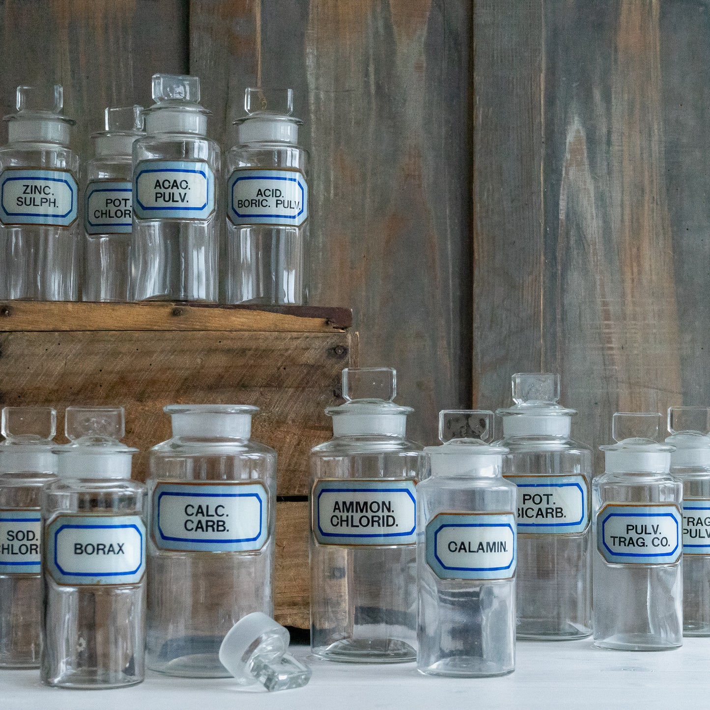 Vintage Glass Chemistry Bottles with Blue and White Labels