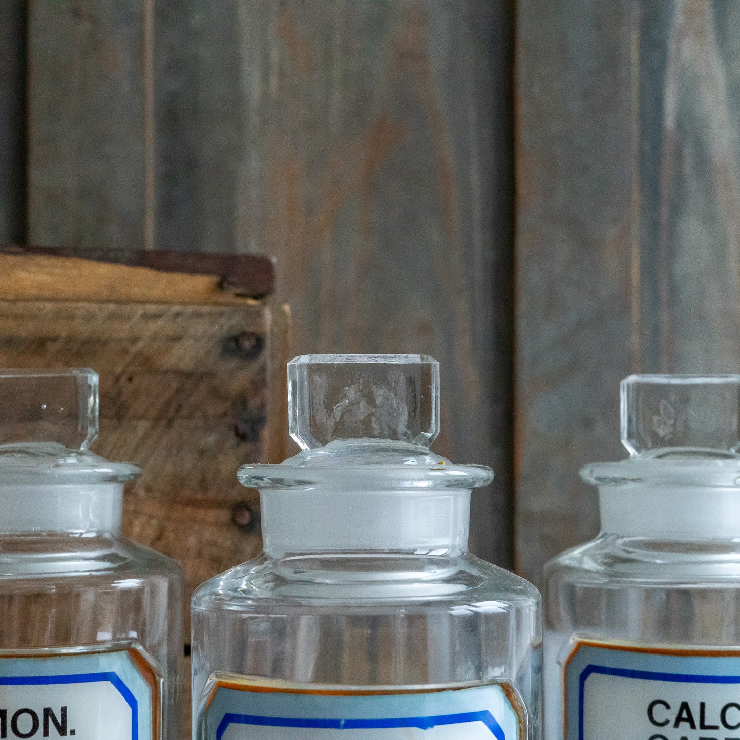 Vintage Glass Chemistry Bottles with Blue and White Labels