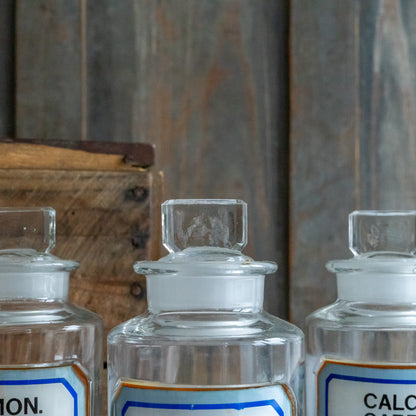 Vintage Glass Chemistry Bottles with Blue and White Labels