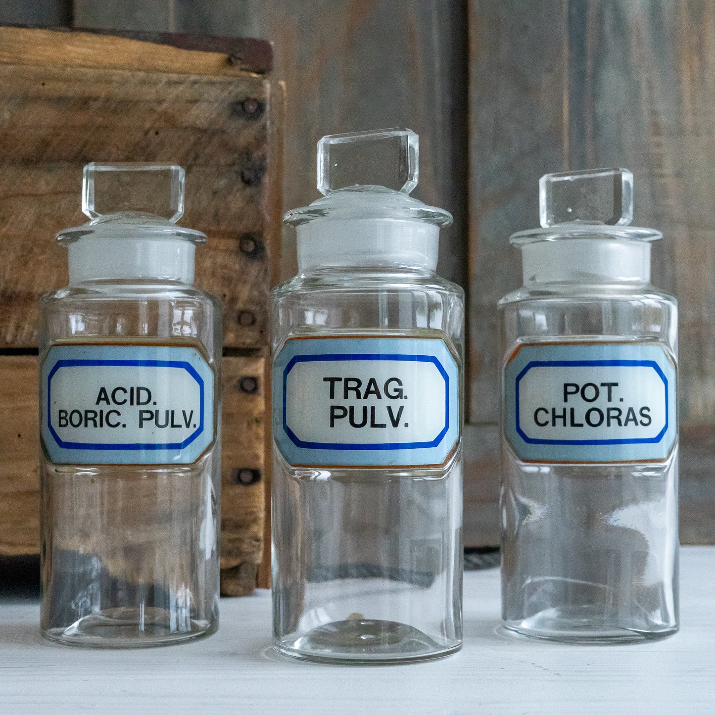 Vintage Glass Chemistry Bottles with Blue and White Labels