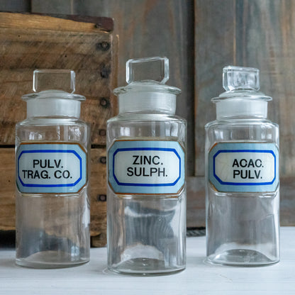 Vintage Glass Chemistry Bottles with Blue and White Labels